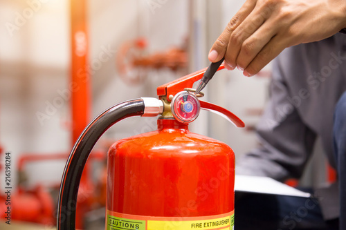 Engineer inspection Fire extinguisher in control room.