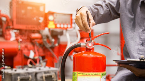 Engineer inspection Fire extinguisher in control room.