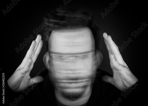 A Man Holding His Head and Shaking