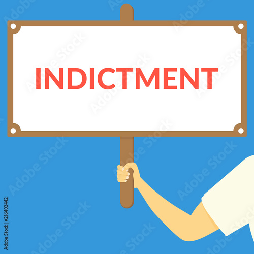 INDICTMENT. Hand holding wooden sign