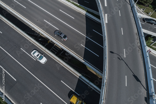 Aerial view of highway and overpass in city on sunny day © Bob