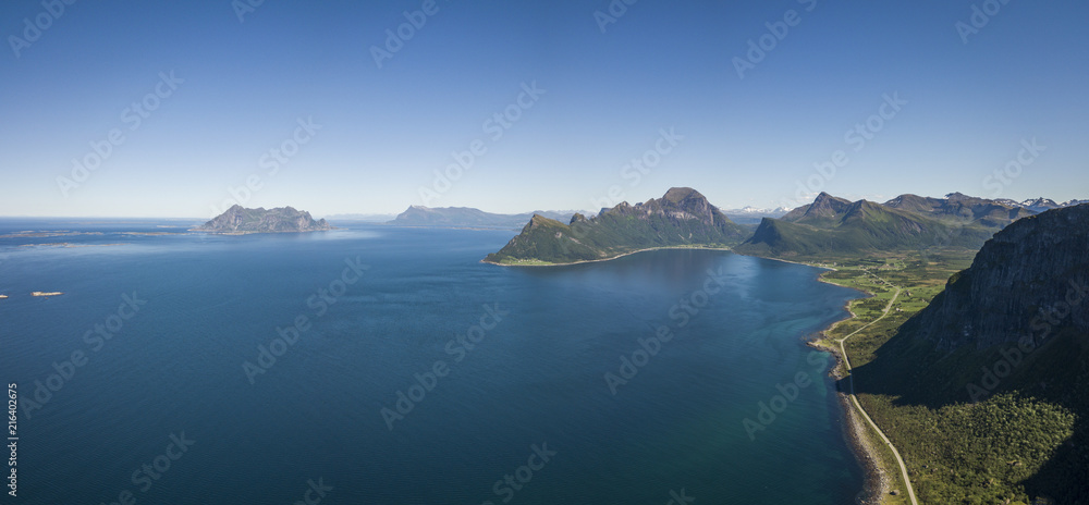 Fototapeta premium Aerial view towards the open sea, Fugloya, Lofotveggen or the Lofoten Wall and the horizon