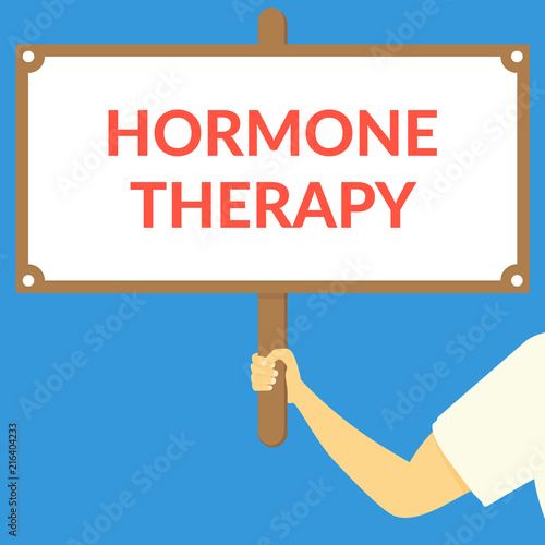 HORMONE THERAPY. Hand holding wooden sign