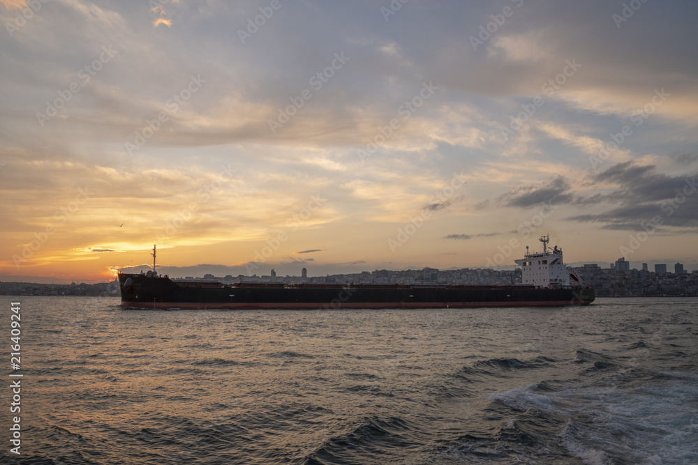 international oil tanker ship in sunset