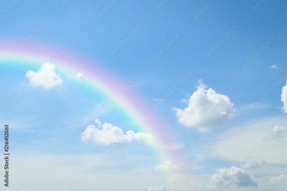 Cloudscape with blue sky and white clouds rainbow Cloudscape with blue sky and white clouds rainbow