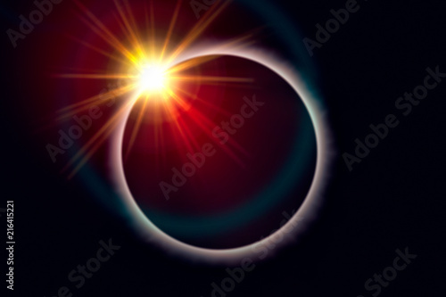 Total solar eclipse. Sunbeams burst behind the moon and create the diamond ring effect