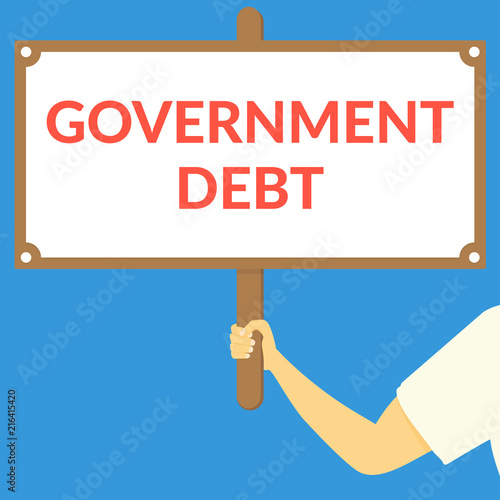 GOVERNMENT DEBT. Hand holding wooden sign