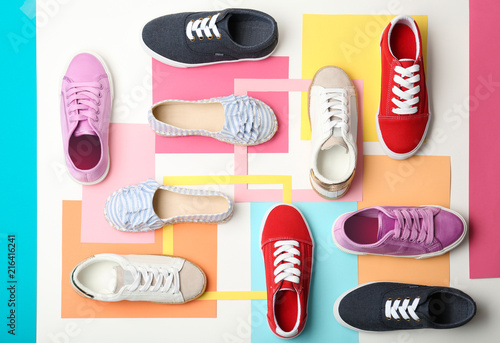 Flat lay composition with stylish new shoes on color background