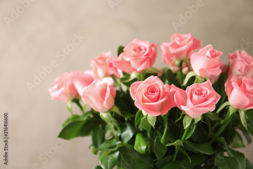 Bouquet of beautiful roses on blurred background