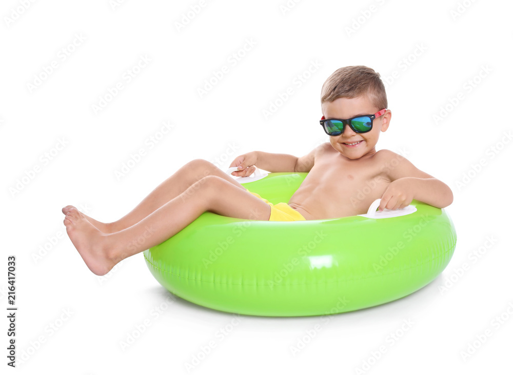 Fototapeta premium Cute little boy with inflatable ring on white background