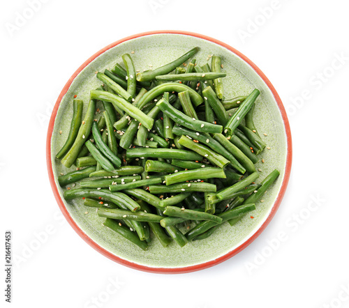 Plate with tasty green beans on white background