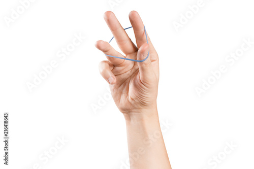 Hand playing with elastic hair band on white background