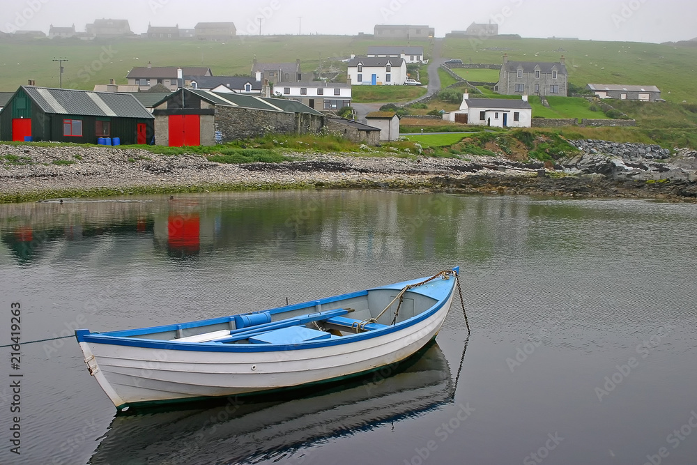 Row boat on a misty day near Lerwick, Shetland Islands, Scotland.