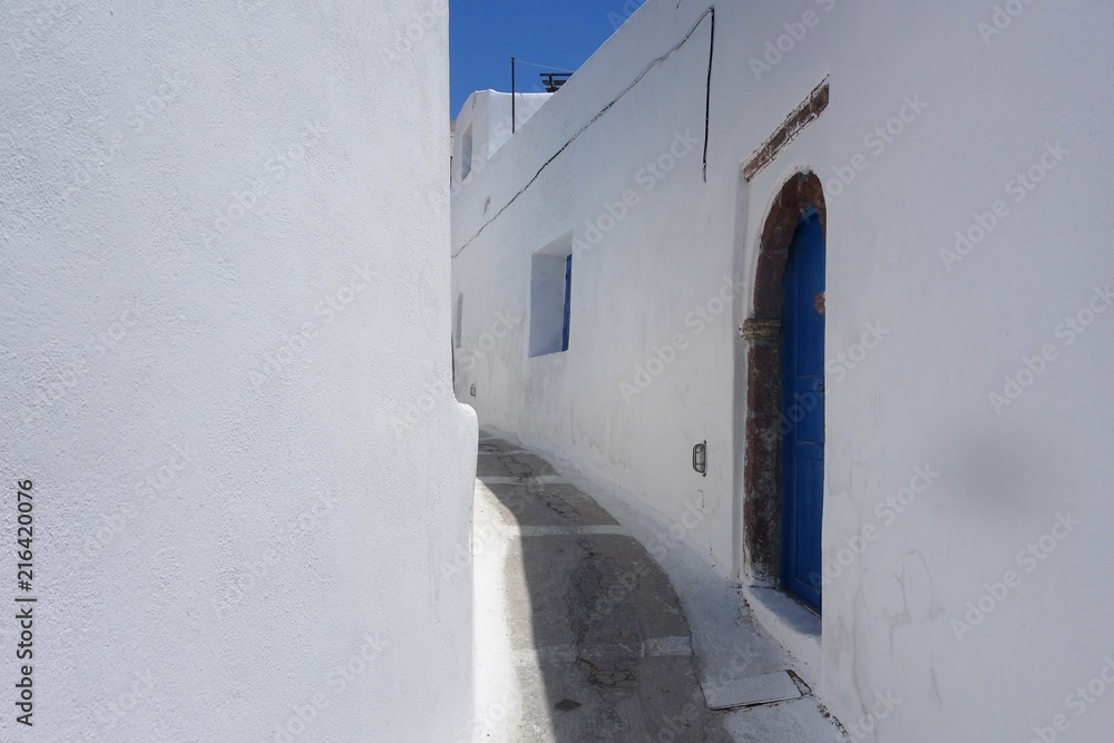 Summer day on a narrow street in Emporio, on the island of Santorini Summer day on a narrow street in Emporio, on the island of Santorini