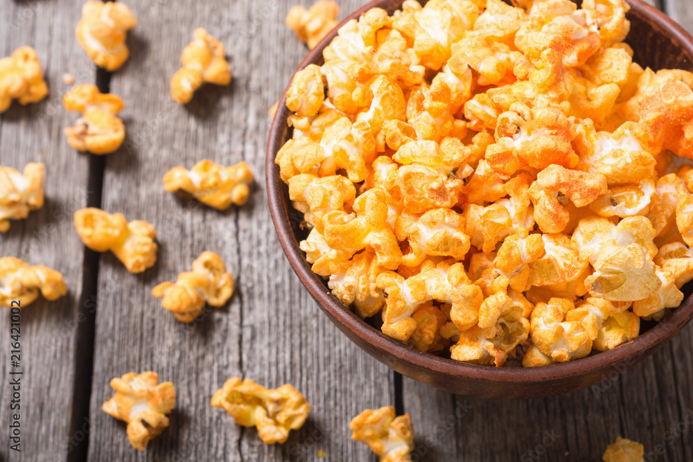 Yellow cheese popcorn in bowl Yellow cheese popcorn in bowl