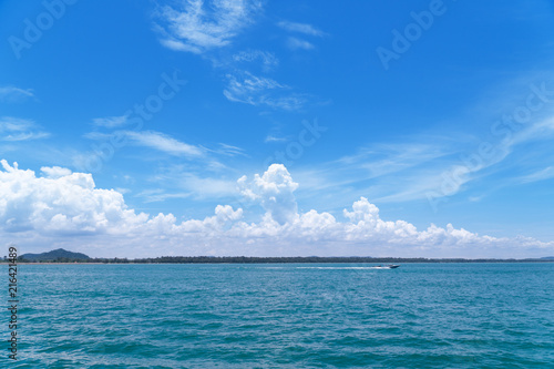 A boat on the sea with blue sky background. Maritime transport.