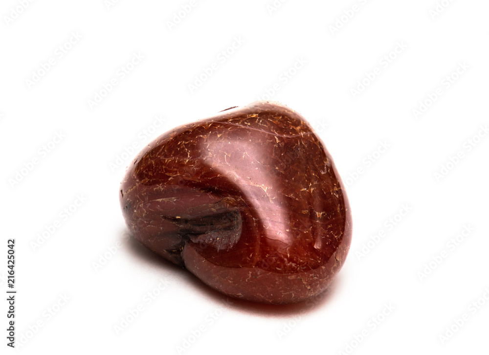 Carnelian is a brownish-red mineral commonly used as a semi-precious gemstone. Isolated on white background Carnelian is a brownish-red mineral commonly used as a semi-precious gemstone. Isolated on white background