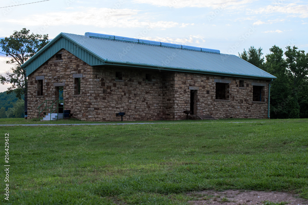 An old brick school house makes a nice picnic shelter at a park area. An old brick school house makes a nice picnic shelter at a park area.