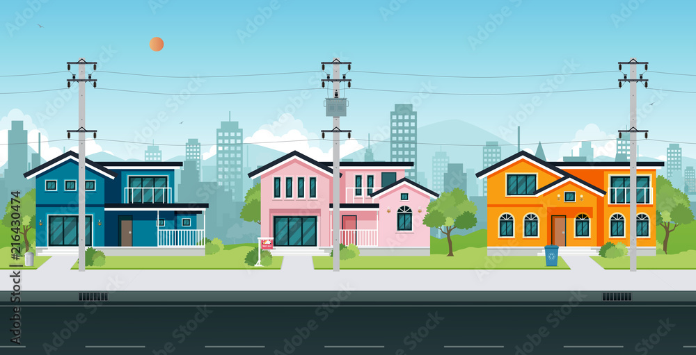 Urban houses with electric poles and cable on the street.