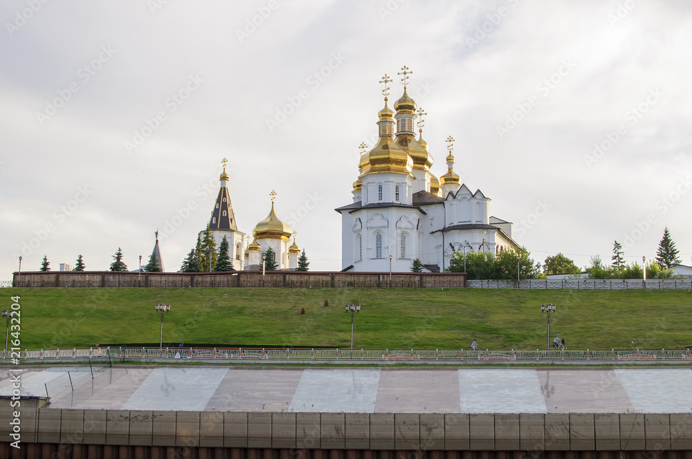 Tura River Embankment in Tyumen, Russia. Holy Trinity Monastery.