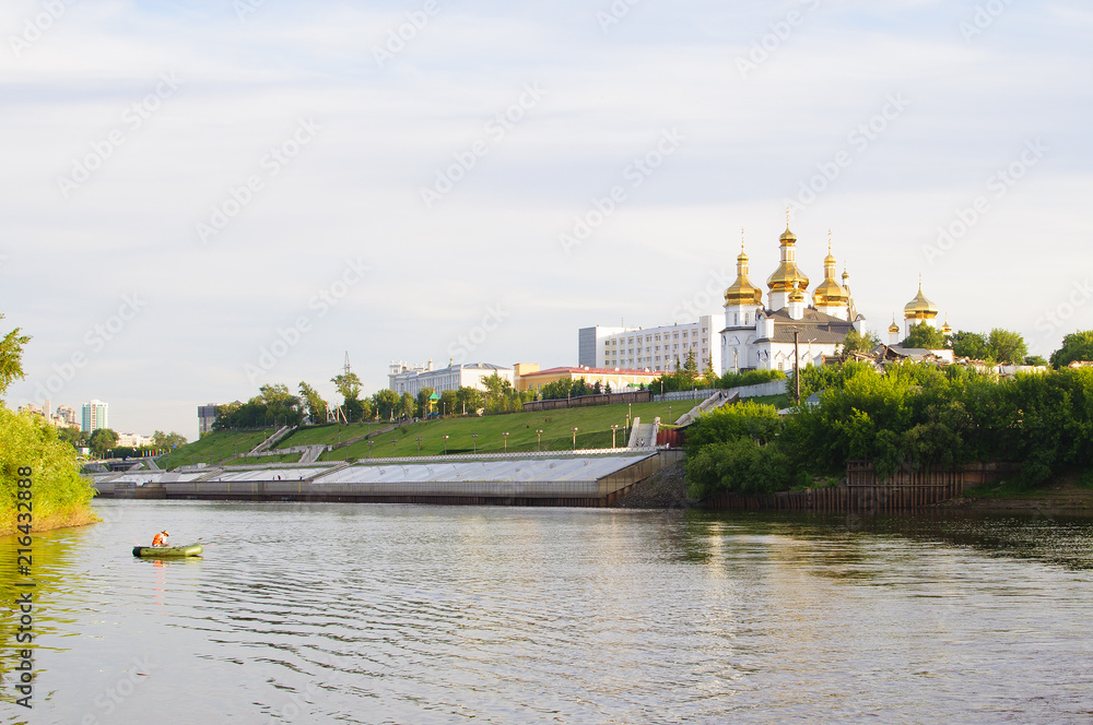 Tura River Embankment in Tyumen, Russia. Holy Trinity Monastery. Tura River Embankment in Tyumen, Russia. Holy Trinity Monastery.