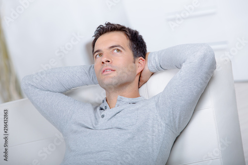 man on sofa thinking