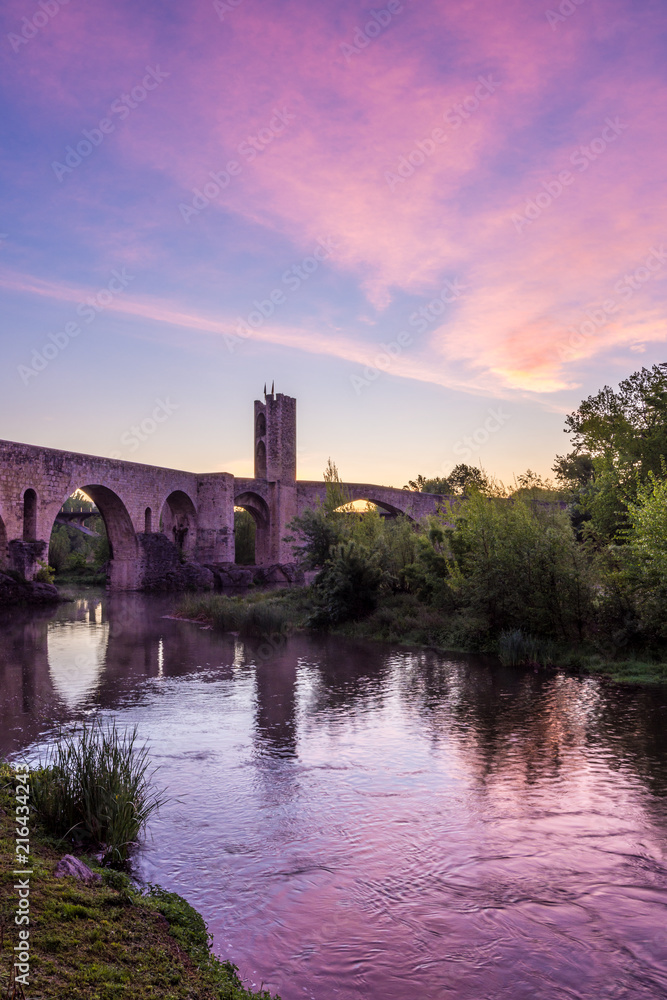 Sunrise at the Medieval bridge of the Besalu (Catalonia, Spain)