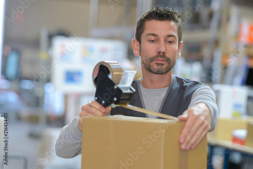 man securing the order inside the box