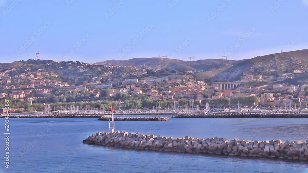 arrival by boat at the port of Marseille with a view of the neighborhoods of Les Riaux and L'Estaque in the background arrival by boat at the port of Marseille with a view of the neighborhoods of Les Riaux and L'Estaque in the background
