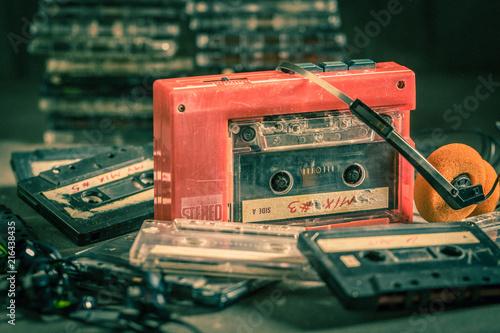 Antique audio cassette with walkman and headphones