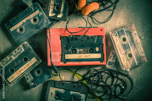 Classic audio cassette with walkman and headphones photo