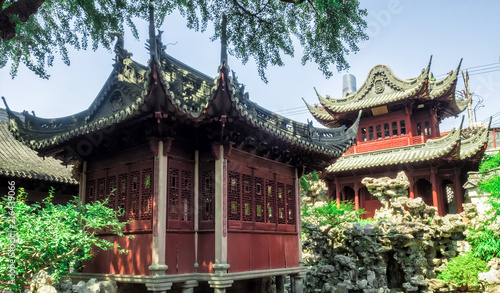 Red temple, traditional chinese buildings and rocks at Yu Gardens, Shanghai, China