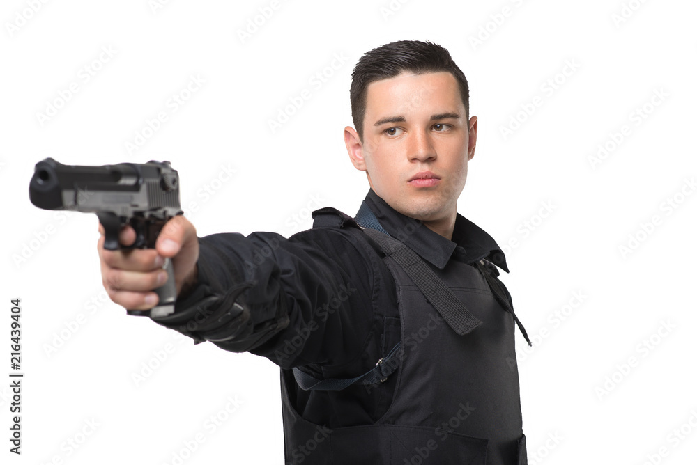 Policeman aims with a gun, front view Policeman aims with a gun, front view