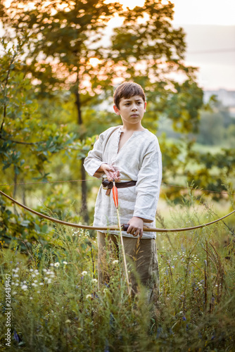 Young boy with a bow