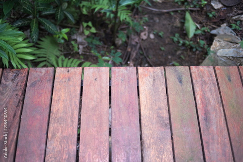 Empty wooden on front blurred nature background, copy space