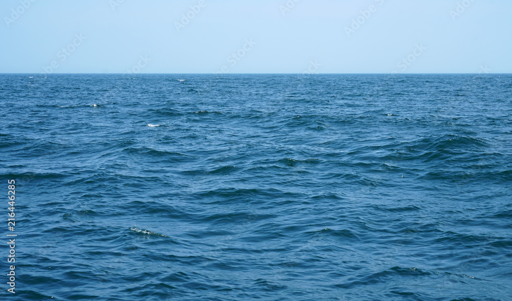 blue ocean and wave ripple with horizon line as background blue ocean and wave ripple with horizon line as background