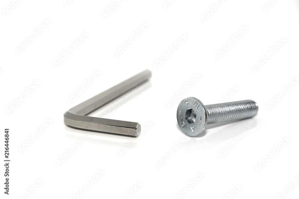 Isolated Allen screw driver wrench with a screw on white background Isolated Allen screw driver wrench with a screw on white background