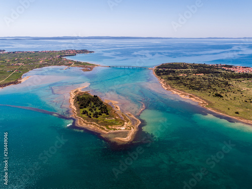Fototapeta Naklejka Na Ścianę i Meble -  Aerial view of bridge to island Vir over the Adriatic sea with small island Viric in the foreground, Zadar county, Croatia