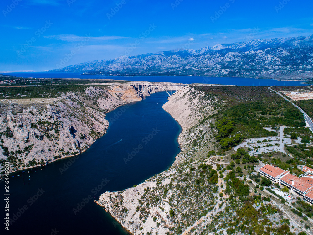 The Maslenica bridge is a deck arch bridge carrying the D8 state road, Zadar county, Croatia, aerial drone  photo