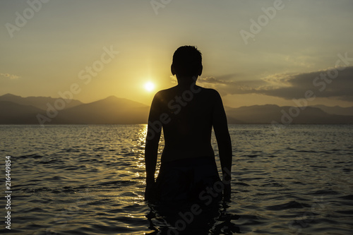 Silhouette of child on the beach