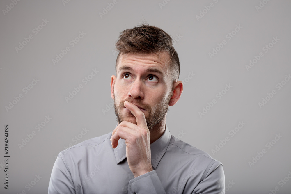 Thoughtful businessman deep in thought Thoughtful businessman deep in thought