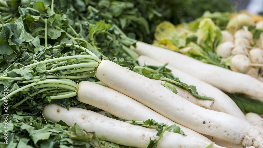 Fresh daikon radishes at a farmer's market. Fresh daikon radishes at a farmer's market.