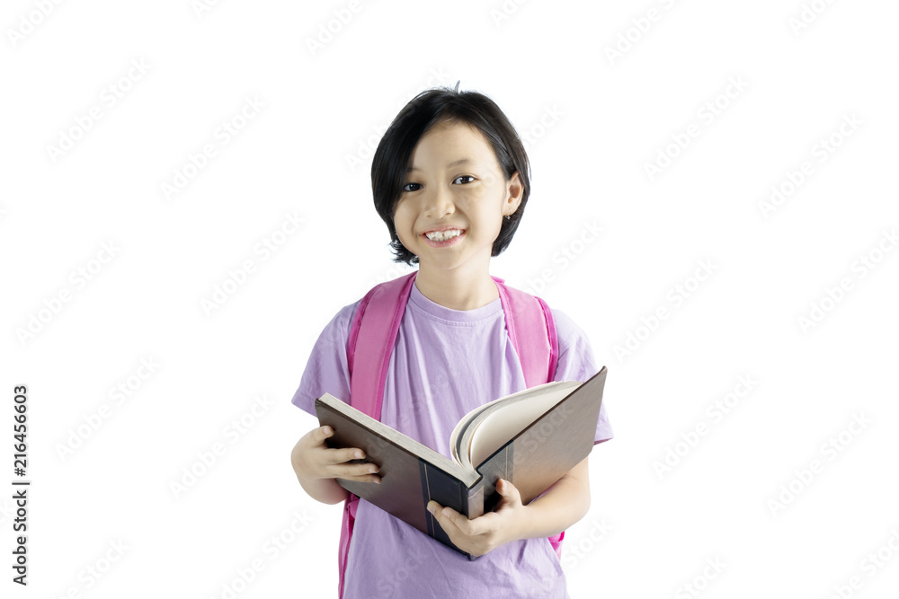 Cute little girl studying with a book on studio Cute little girl studying with a book on studio