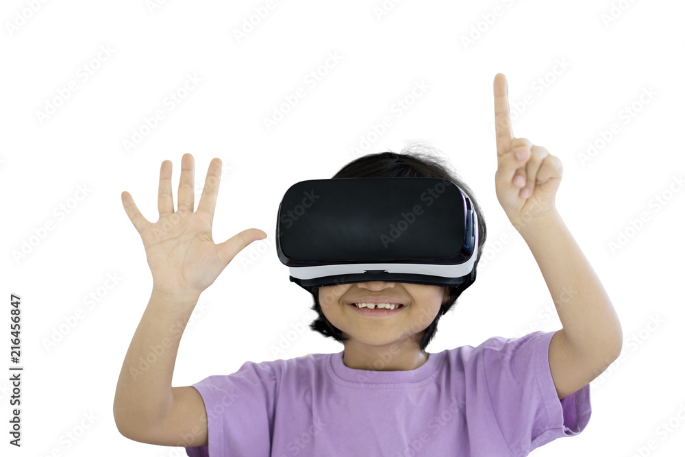 Cute schoolgirl using a virtual reality goggles