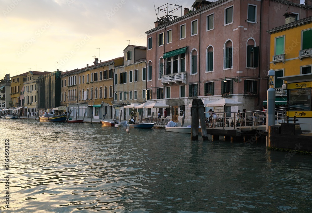 Venice,Italy-July 24, 2018 : Houses and shops near Guglie bridge on Cannaregio canal, Venice 
