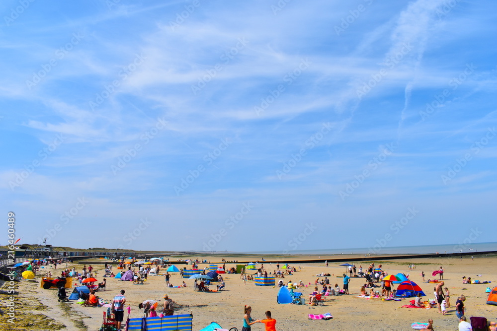Tourists on their summer holidays, Minnis Bay, Birchington, Kent, UK