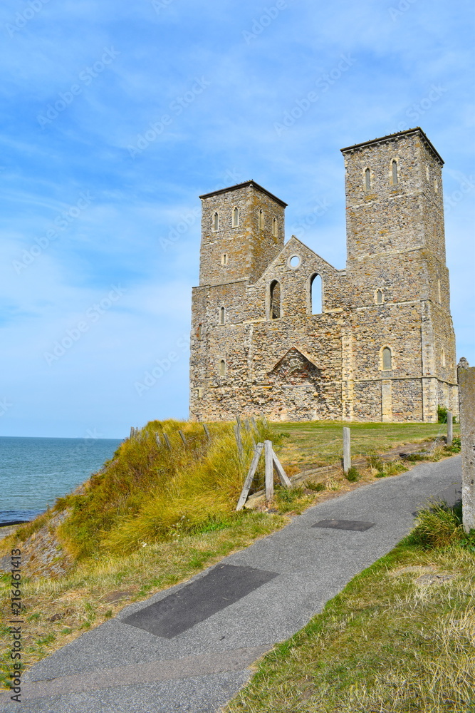 The imposing twin towers of the medieval church at Reculver, Herne Bay, Kent, England, August, 2018