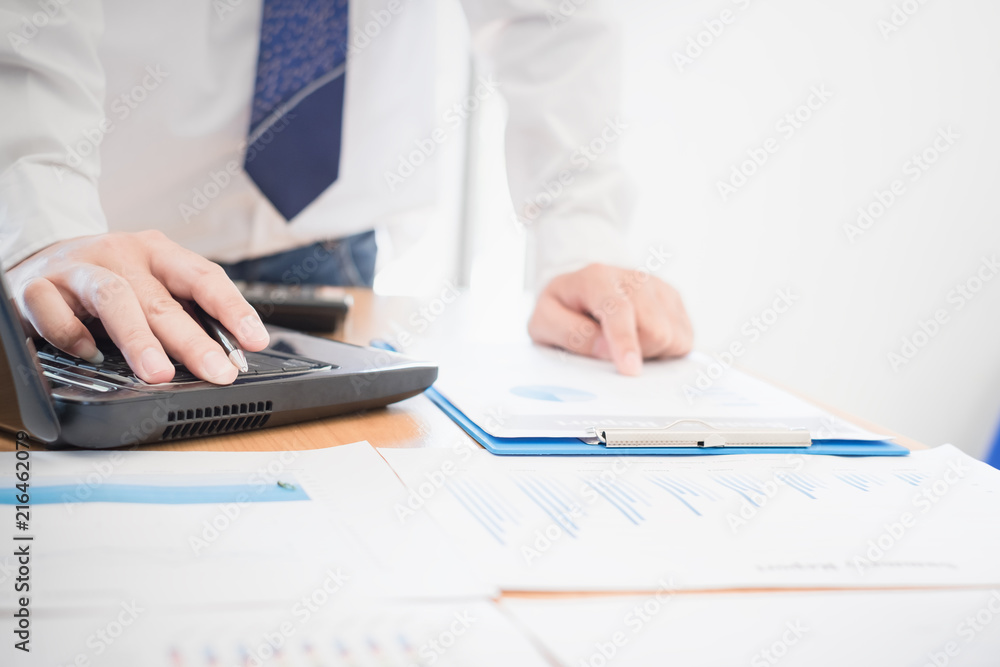Businessman discussion and analysis data at meeting Businessman discussion and analysis data at meeting