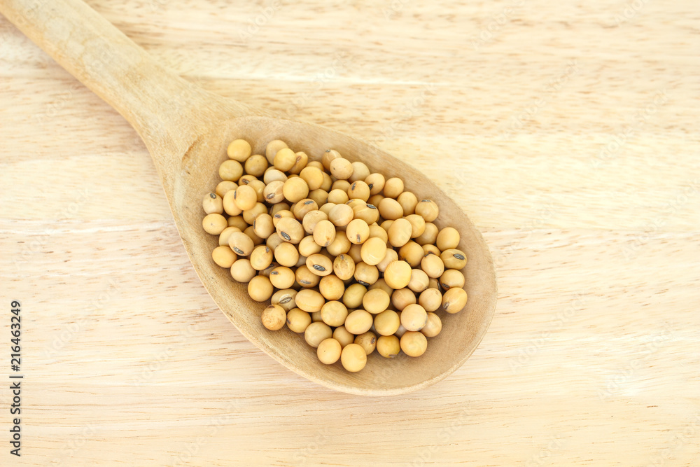 soy bean plant seed in spoon healthy vegetable food on wooden background soy bean plant seed in spoon healthy vegetable food on wooden background