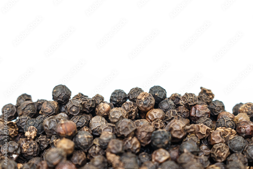 black peppercorns heap on white background. black peppercorns heap on white background.